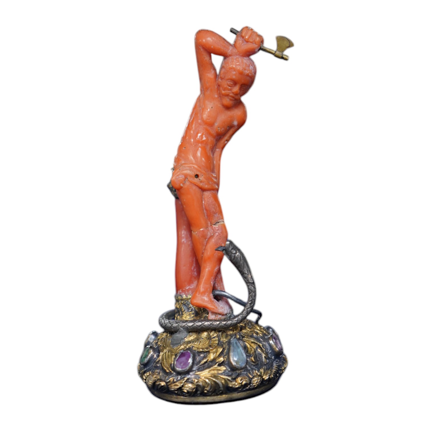 A 19th century French? gilt white metal, coral and multi gem-set table seal, modelled as a gentleman attacking a serpent with an axe, on a rustic gem set oval base, inset with carnelian, 93mm. Condition - poor